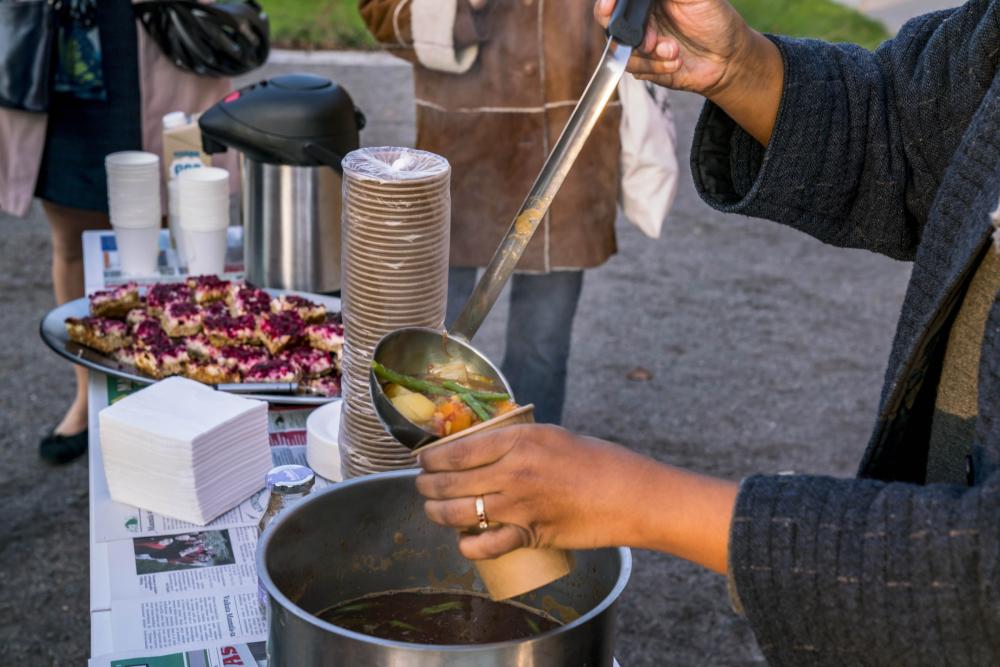 Partizaning Maunula, serving soup at the event 