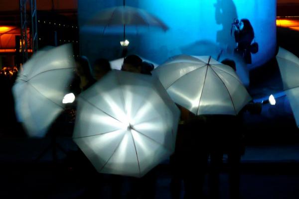 Fish-Go-Round! lit umbrellas and dark background